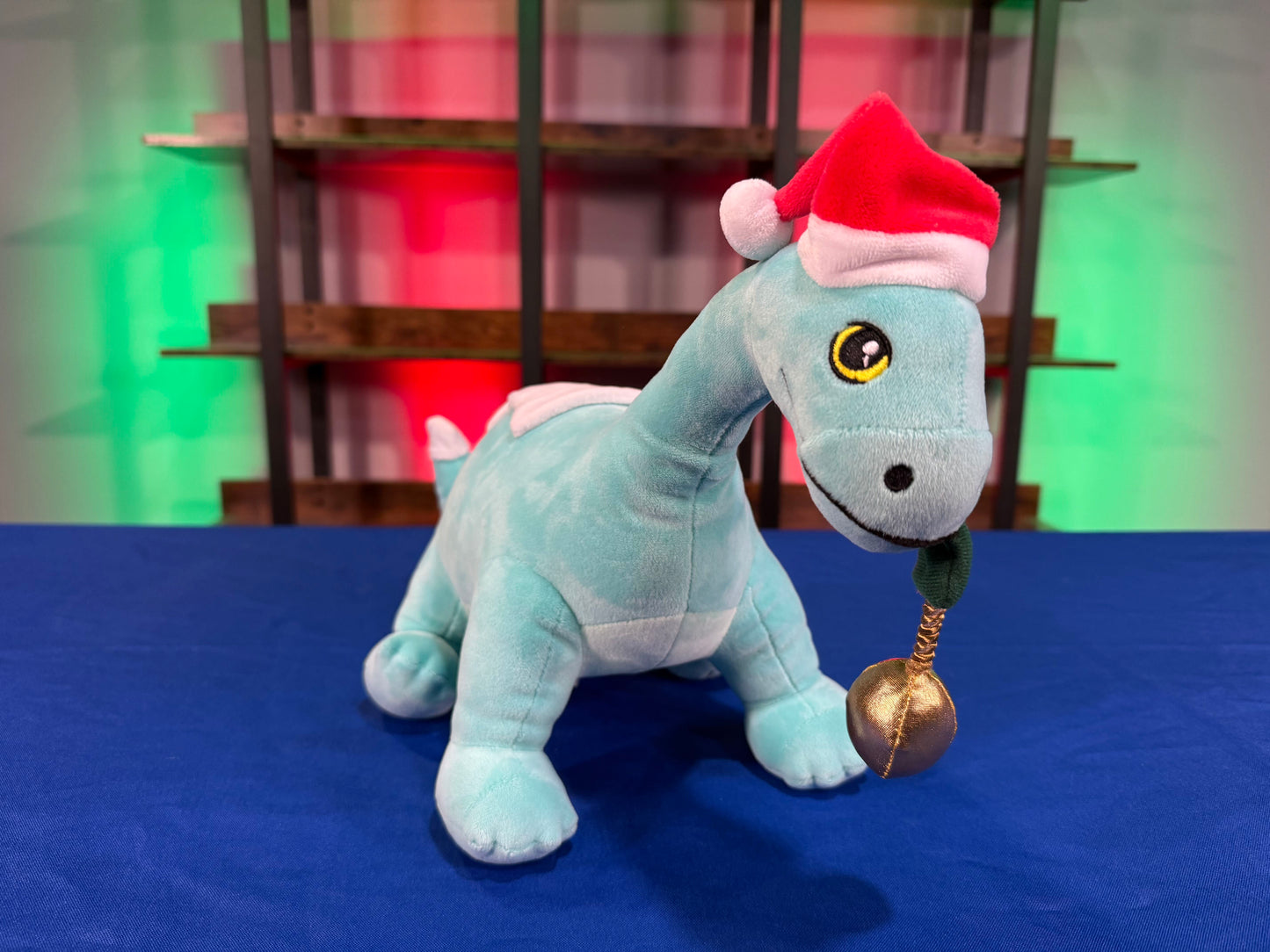 Santa Gertie Dinosaur Plush with Lighted Ornament (PRE-ORDER)