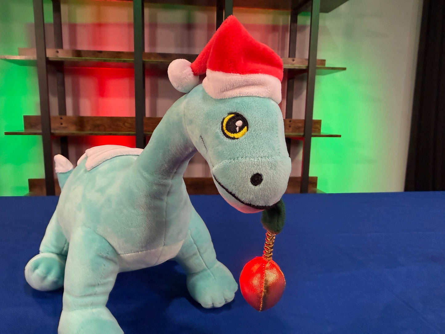 Santa Gertie Dinosaur Plush with Lighted Ornament (PRE-ORDER)